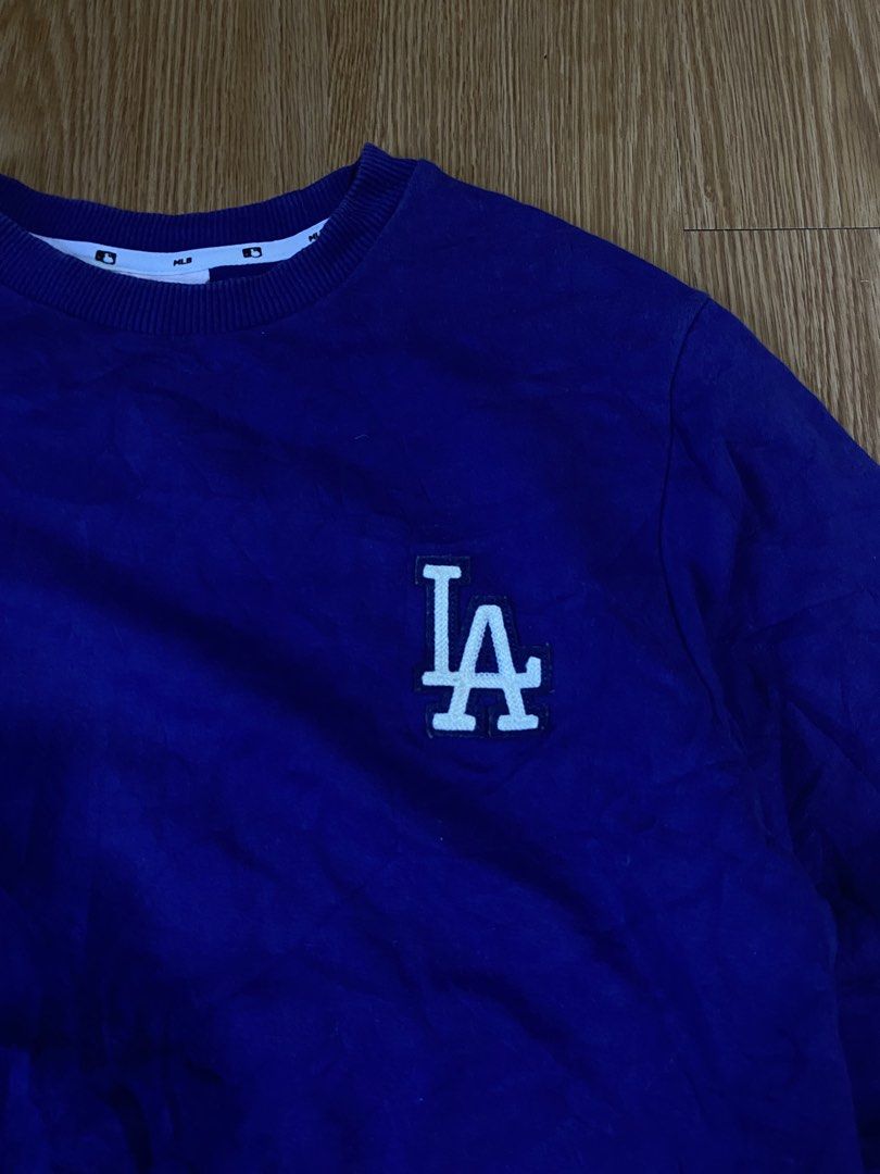 MLB LA Dodgers Crewneck Sweater (Category: Coats, Jackets and Outerwear) located in Lapu Lapu. Submitted by jess12-25-20005 (Listing ID 1469282871, Image 2). Description: Authentic Complete tags Small-Medium L25.5 W20.6 Condition: 9.5/10 Color rate: 9.5/10 No issue.
