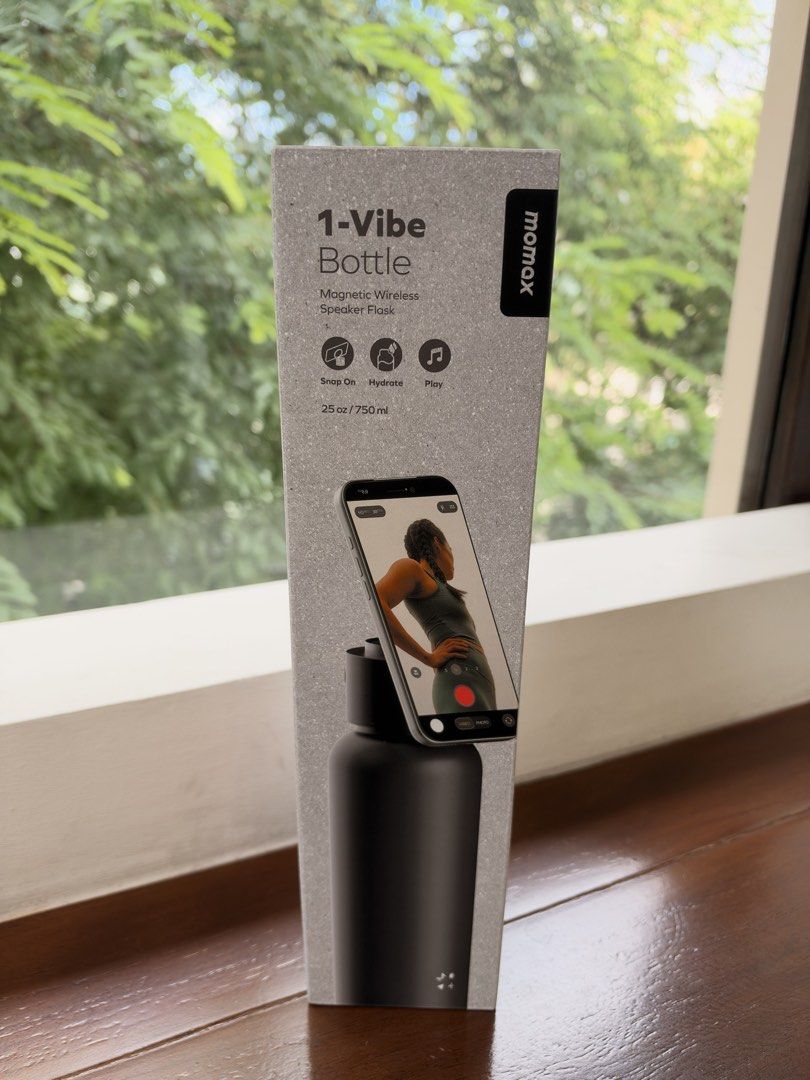 Momax Magnetic Wireless Speaker Flask (Category: Water Bottles & Tumblers) located in Quezon City. Submitted by celinelacuna (Listing ID 1469241518, Image 1). Description: Momax 1-Vibe Bottle - Magnetic Wireless Speaker Flask - Brand new & sealed in box - Color: Sleek Black - 750ml capacity water flask - 3-in-1 design: Water bottle, Bluetooth speaker, and phone stand - Built-in speaker located in the cap - IPX7 waterproof rating for worry-free us