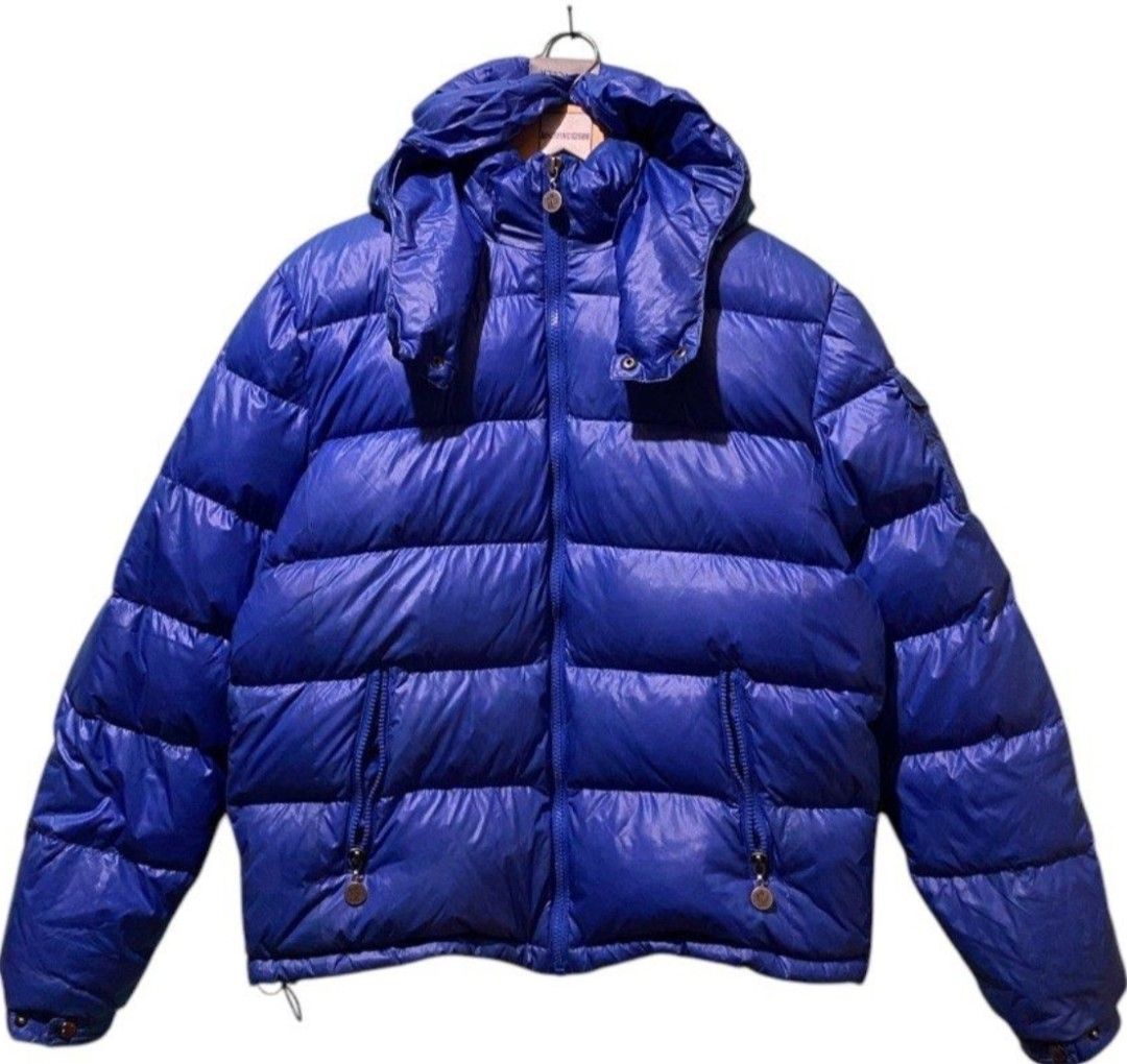 Moncler Blue Down Puffer Jacket Size L (Category: Coats, Jackets and Outerwear) located in Makati City. Submitted by bastybb (Listing ID 1469207416, Image 1). Description: DECLUTTERING! Selling for 800 only! (negotiable) - Brand: Moncler - Color: Vibrant royal blue with a glossy finish - Size: L (tag attached at collar) - Features: Detachable hood with snap buttons, branded zipper pull and hardware - Detail: Classic felt Moncler logo patch on the