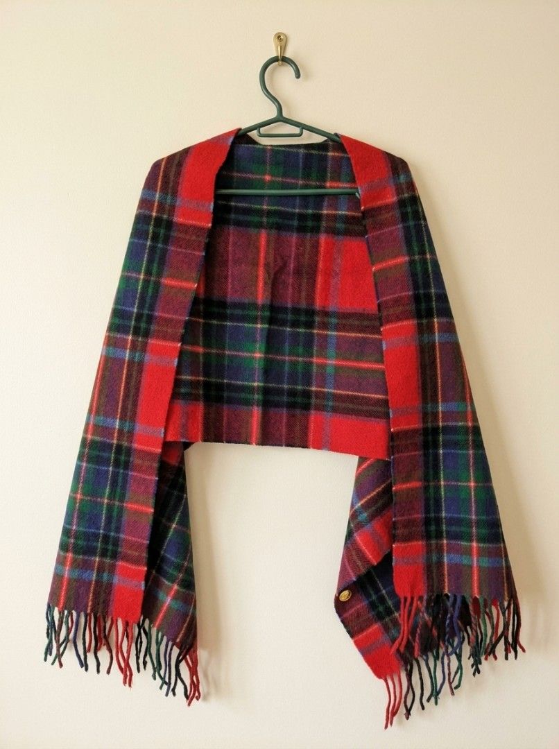 Moonbat Tartan Plaid Scarf Red Multi (Category: Scarves) located in Pasig City. Submitted by kat_grande (Listing ID 1469383914, Image 2). Description: - Brand: Moonbat - Design: Tartan plaid in vibrant red, blue, green, and purple tones - Details: Fringe trim on both ends with care tag attached - Material: 70% polyester, 30% rayon - Condition/Use: Warm, versatile winter accessory to elevate your cold-weather outfits Measurements: Length: 65 inche