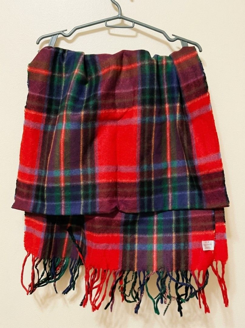 Moonbat Tartan Plaid Scarf Red Multi (Category: Scarves) located in Pasig City. Submitted by kat_grande (Listing ID 1469383914, Image 3). Description: - Brand: Moonbat - Design: Tartan plaid in vibrant red, blue, green, and purple tones - Details: Fringe trim on both ends with care tag attached - Material: 70% polyester, 30% rayon - Condition/Use: Warm, versatile winter accessory to elevate your cold-weather outfits Measurements: Length: 65 inche