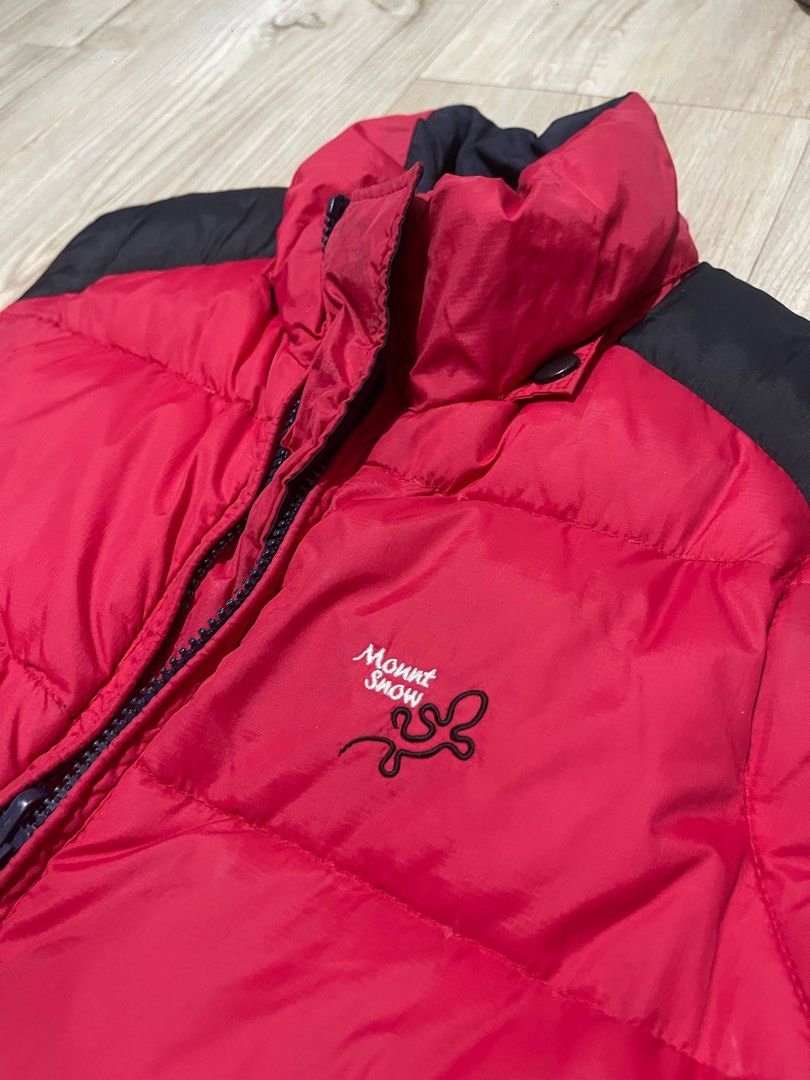 Mount Snow puffer vest red black winter outerwear (Category: Vests) located in Baguio. Submitted by find_found001 (Listing ID 1469338787, Image 2). Description: - Brand: Mount Snow - Colorway: Red and black - Design: Stand collar, full zip closure, and front welt pockets - Details: Embroidered logo text and gecko graphic on chest, plus blue logo tag on side seam - Comfort: Padded construction for extra warmth in cold weather - Condition: Clean, e