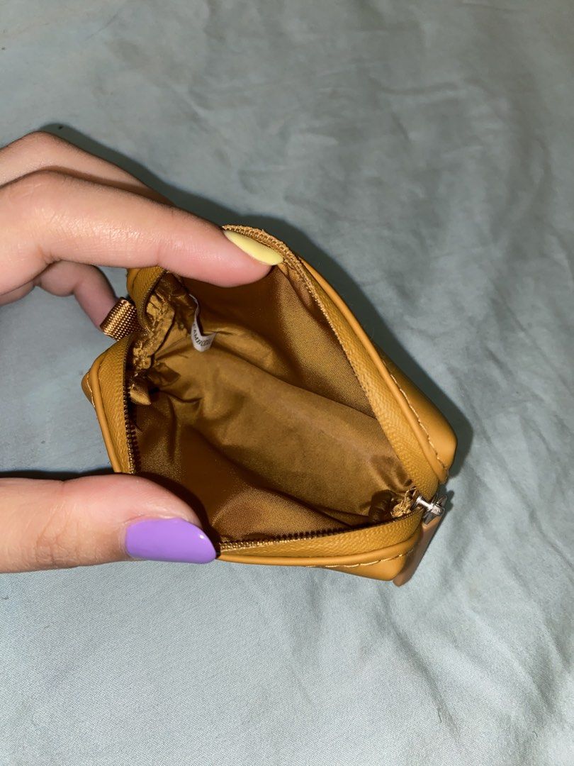 Muji Combination Case (Mustard Yellow) (Category: Purses & Pouches) located in Quezon City. Submitted by alexolotl (Listing ID 1469383079, Image 2). Description: Muji Combination Case Mini in Mustard Yellow Perfect for carrying coins, cards, or small items on the go. Dimensions: 9.6 x 2.3 cm water-repellent and easy-to-clean. Features a metal clip to attach to keyrings or bags. Rfs: not my color, decluttering. MOP: BDO, GCASH (no COD) MOD: Lalamo