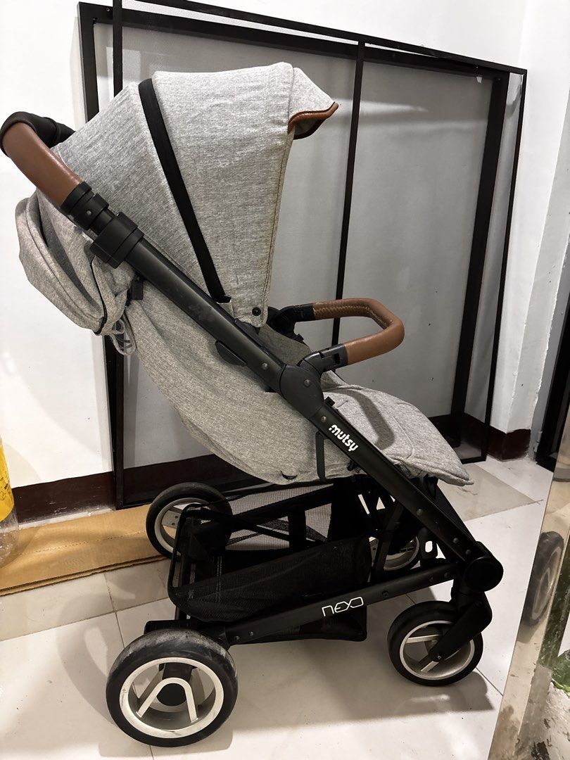 Mutsy Nexo Grey Baby Stroller (Category: Strollers) located in Rodriguez. Submitted by anjloving (Listing ID 1469268682, Image 3). Description: - Model: Mutsy Nexo Stroller - Color: Grey melange fabric with brown leatherette handles - Fully adjustable backrest for maximum comfort - Compact folding frame that fits easily in car boots - Smooth wheels with front swivel action for easy maneuvering - Large storage basket underneath for your essentials