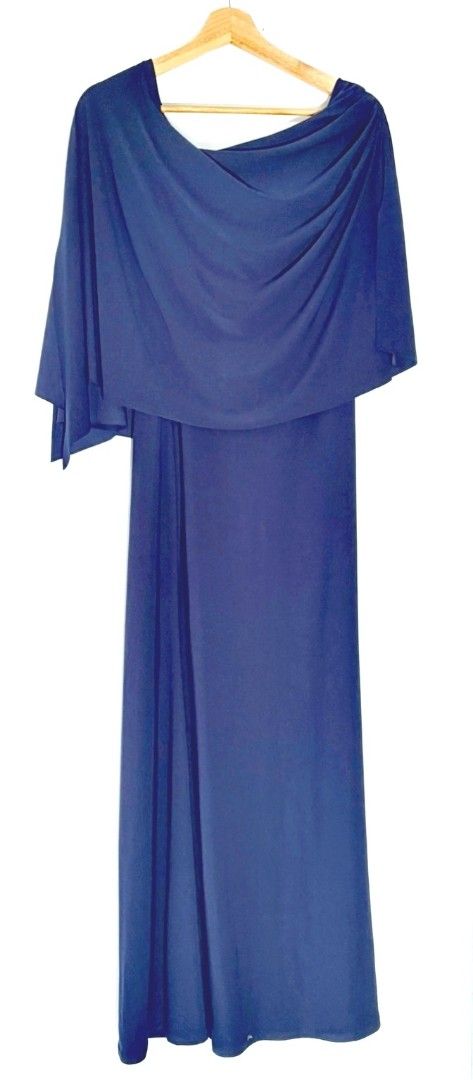 Navy Blue One-Shoulder Gown (Category: Dresses) located in Pasig City. Submitted by elegantdress (Listing ID 1469234269, Image 1). Description: - Color: Deep blue - Length: Full-length gown - Design: Draped asymmetrical cape overlay across shoulders and chest with a long flowing skirt - Occasion: Ideal for formal events, weddings, or evening dinners.