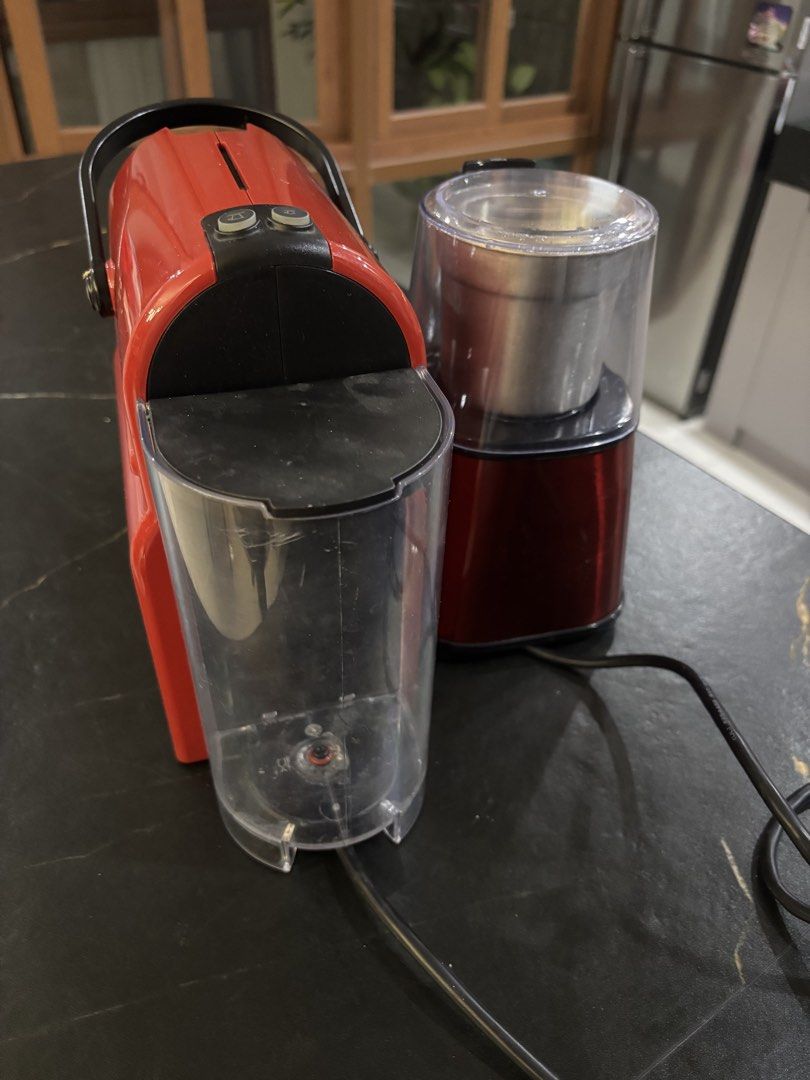 Nespresso Red Coffee Maker and Baumann Living Grinder (Category: Coffee Machines & Makers) located in Manila. Submitted by leana678910 (Listing ID 1469274485, Image 2). Description: - Red Nespresso capsule coffee machine matching Baumann Living grinder - Barely Used, Good condition - Clean water tank and drip tray - Standard power plugs - Perfect, ready-to-use setup for daily home espresso QC/ Manila Pickup.