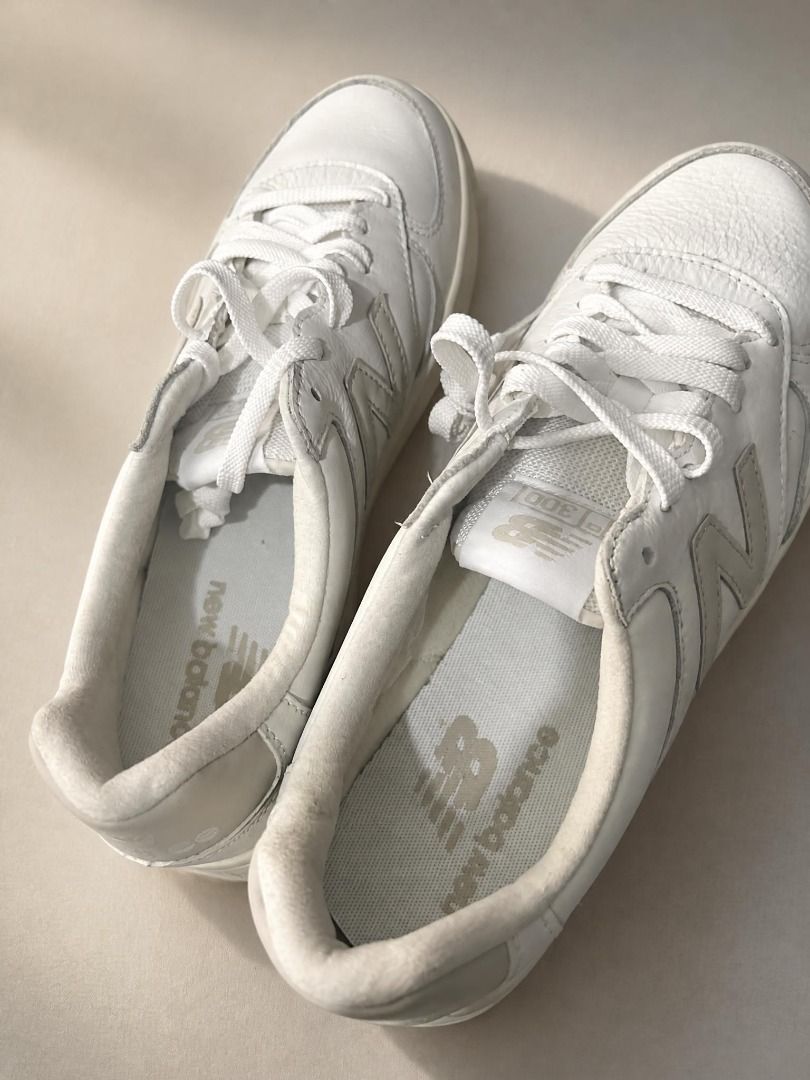 New Balance 300 White Sneakers (Category: Sneakers) located in Manila. Submitted by rachelandkokoy (Listing ID 1469230345, Image 1). Description: - Brand: New Balance - Model: 300 Court Sneakers - Color: White leather with grey logo accents - Style: Low-top, everyday casual kicks - Features: Clean white laces, cushioned insoles, rubber outsoles - Condition: Light wear around the collar lining, overall well-maintained - Bought in the US but never 