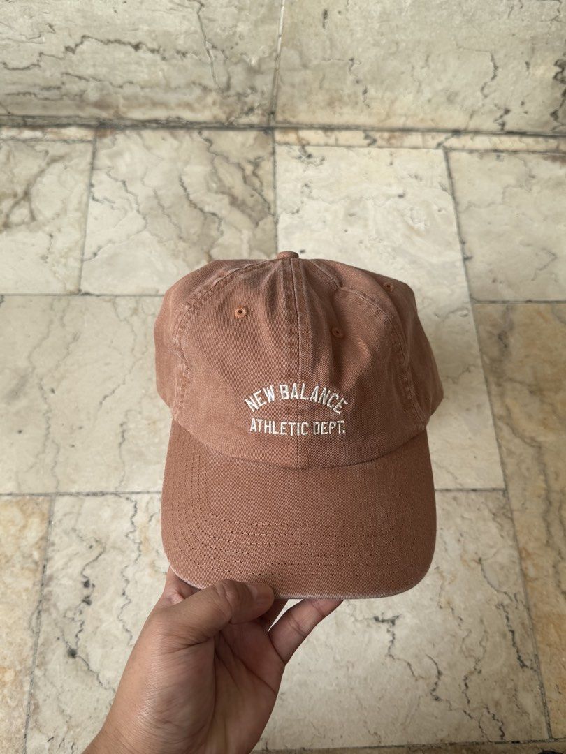 New Balance Athletic Dept Brown Cap (Category: Caps & Hats) located in San Pedro. Submitted by moonllax (Listing ID 1469238090, Image 2). Description: - Brand: New Balance - Color: Brown with white embroidered lettering ("New Balance Athletic Dept") - Style: Classic dad hat / curved brim - Closure: Adjustable strap with metal buckle - Condition: Brand new with tags attached -Legit/authentic. Money back if proven fake (from 🇺🇸🇺🇸🇺🇸).