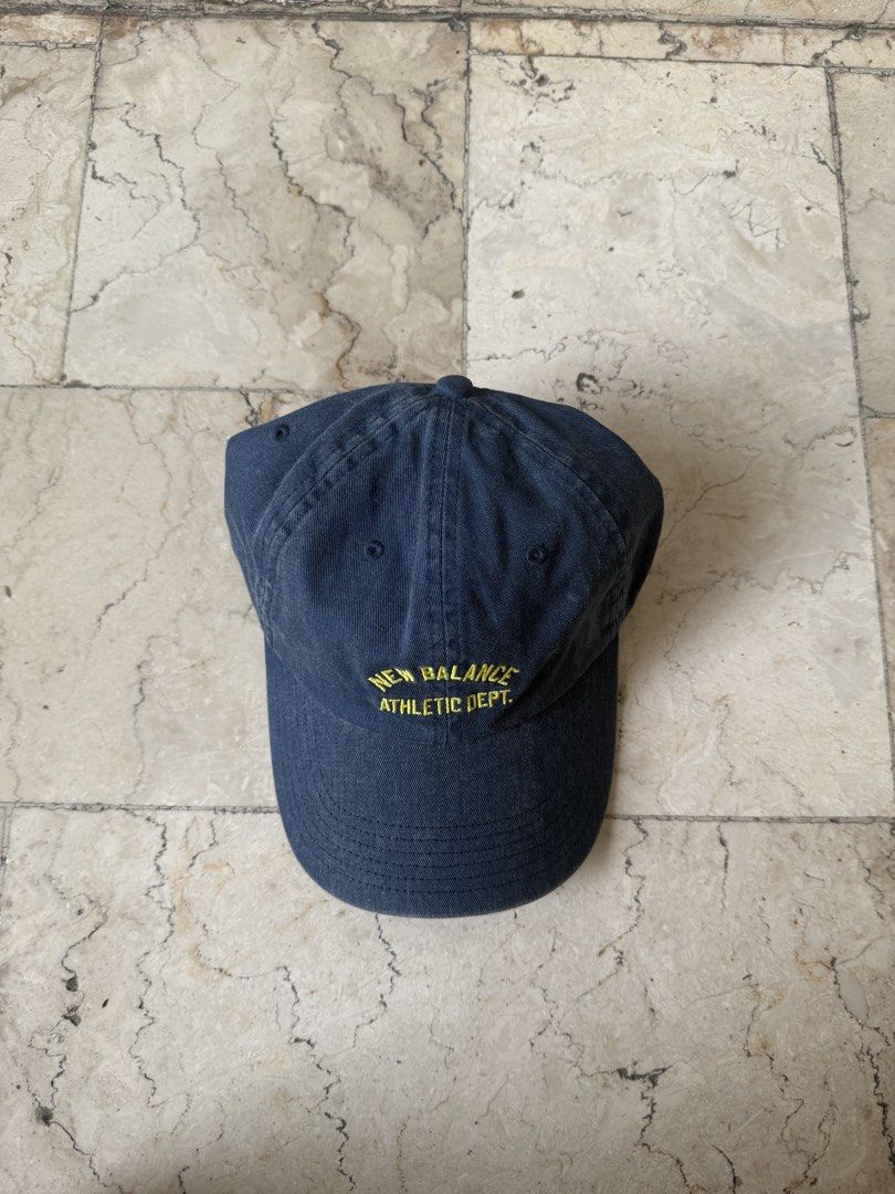 New Balance Athletic Dept Cap Navy Blue (Category: Caps & Hats) located in San Pedro. Submitted by moonllax (Listing ID 1469238249, Image 2). Description: - Brand: New Balance - Color: Navy blue with yellow embroidered 'New Balance Athletic Dept' lettering - Style: Curved brim, washed look design - Fit: Adjustable strap with metal buckle - Condition: Brand new with tags still attached -LEGIT🇺🇸🇺🇸🇺🇸.