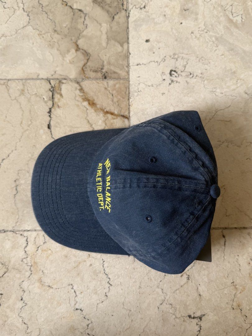 New Balance Athletic Dept Cap Navy Blue (Category: Caps & Hats) located in San Pedro. Submitted by moonllax (Listing ID 1469238249, Image 3). Description: - Brand: New Balance - Color: Navy blue with yellow embroidered 'New Balance Athletic Dept' lettering - Style: Curved brim, washed look design - Fit: Adjustable strap with metal buckle - Condition: Brand new with tags still attached -LEGIT🇺🇸🇺🇸🇺🇸.