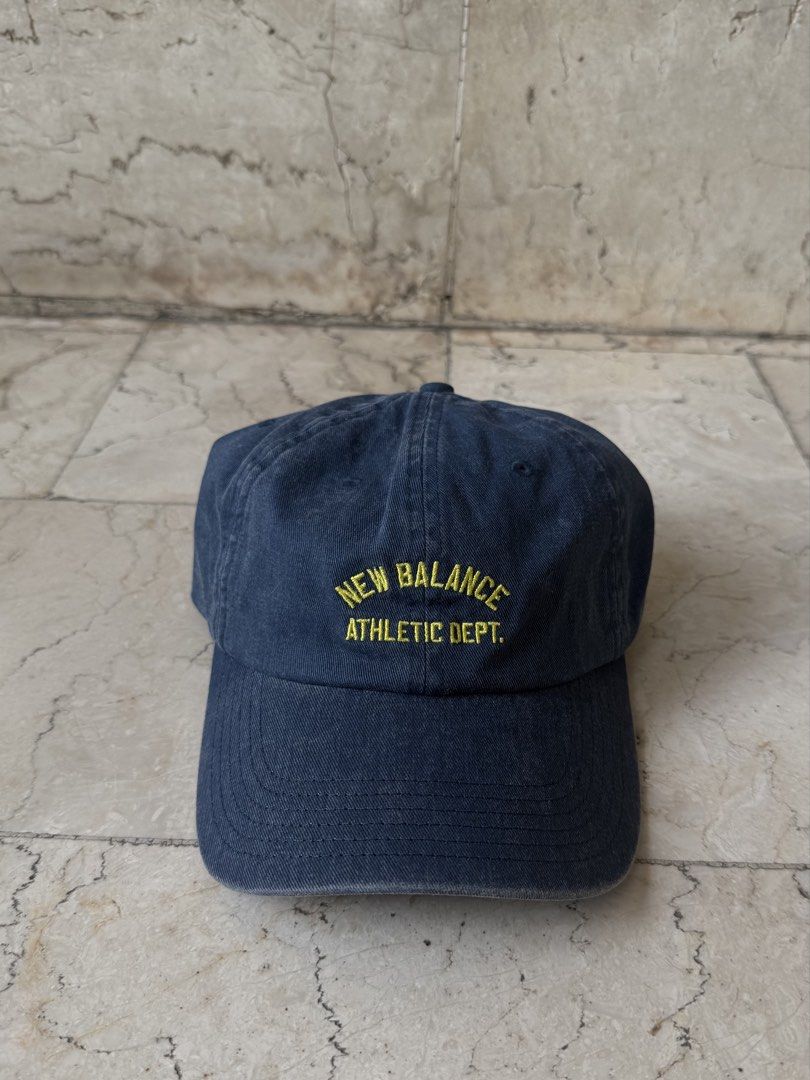 New Balance Athletic Dept Cap Navy Blue (Category: Caps & Hats) located in San Pedro. Submitted by moonllax (Listing ID 1469238249, Image 1). Description: - Brand: New Balance - Color: Navy blue with yellow embroidered 'New Balance Athletic Dept' lettering - Style: Curved brim, washed look design - Fit: Adjustable strap with metal buckle - Condition: Brand new with tags still attached -LEGIT🇺🇸🇺🇸🇺🇸.