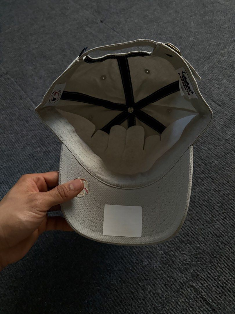 New York Yankees Grey Adjustable Baseball Cap (Category: Caps & Hats) located in Manila. Submitted by toys_hats005 (Listing ID 1469183793, Image 3). Description: - Authentic New York Yankees baseball cap in classic grey - Contrast navy blue embroidered NY logo on the front - Adjustable strapback closure with a sleek metal buckle - Structured front panels with a curved brim - Brand new with genuine merchandise tags still attached - Clean interior 