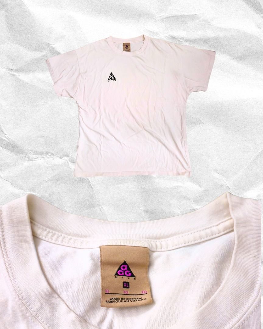 Nike ACG Embroidered Tee in White (Category: Tshirts & Polo Shirts ) located in Mandaluyong City. Submitted by juliaaaaaannnn (Listing ID 1469251985, Image 1). Description: - Size: (XL) 23x28 - Fit: Relaxed fit with short sleeves - Details: Classic triangular ACG logo on chest - Origin: Made in Vietnam.