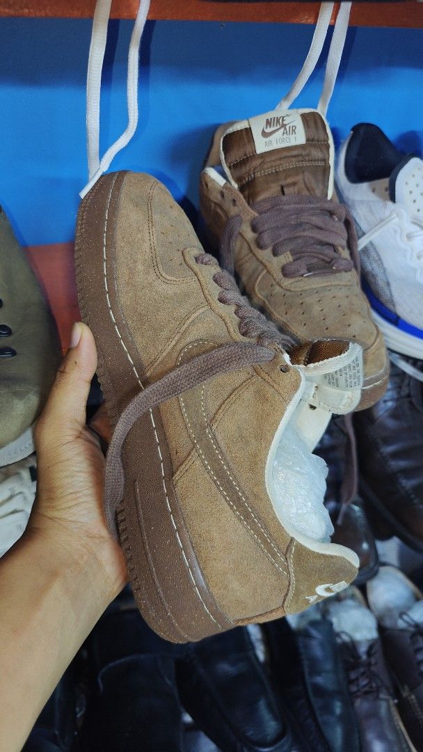 Nike Air Force 1 Brown Suede (Category: Sneakers) located in San Francisco. Submitted by Intaw20 (Listing ID 1469322902, Image 1). Description: - Brand/Model: Nike Air Force 1 - Material: Premium brown suede upper - Details: Thick matching brown laces, speckled rubber sole - Branding: White embroidered Nike Air logo on heel and tongue tag - Condition: Clean uppers with minimal wear on the bottom tread.