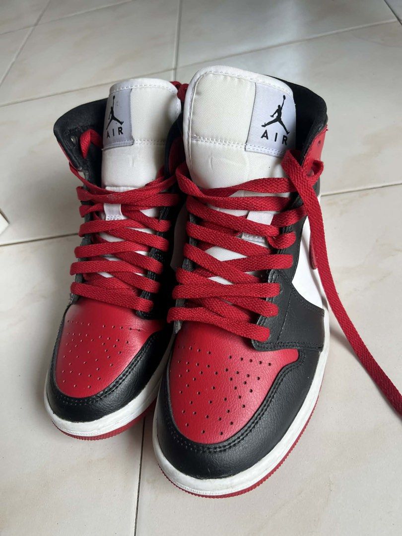 Nike Air Jordan 1 Mid (Category: Sneakers) located in Imus. Submitted by gabcmn (Listing ID 1469336302, Image 3). Description: - Model: Air Jordan 1 Mid (Black/White/Gym Red) - Size: Women's US 7.5 - Condition: Clean uppers with minimal wear on soles - Inclusion: Original box with matching style number (BQ6472-079) - Style: Classic high-top streetwear Rfs: di na nasusuot kasi tumaba paa. Bought it from Nike app for 6,385.50.