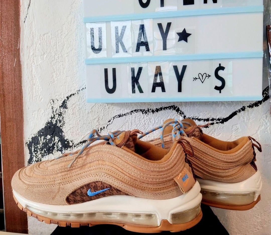 Nike Air Max 97 Brown Blue Sneakers (Category: Sneakers) located in General Mariano Alvarez. Submitted by crisshane_13 (Listing ID 1469188138, Image 1). Description: - Authentic Nike Air Max 97 sneakers in brown - Features stylish tweed side panels and vibrant blue embroidered swoosh - Textured suede uppers with blue patterned rope laces - Comfortable chunky white midsole and durable gum rubber outsole - Full-length visible Air unit for maximum c