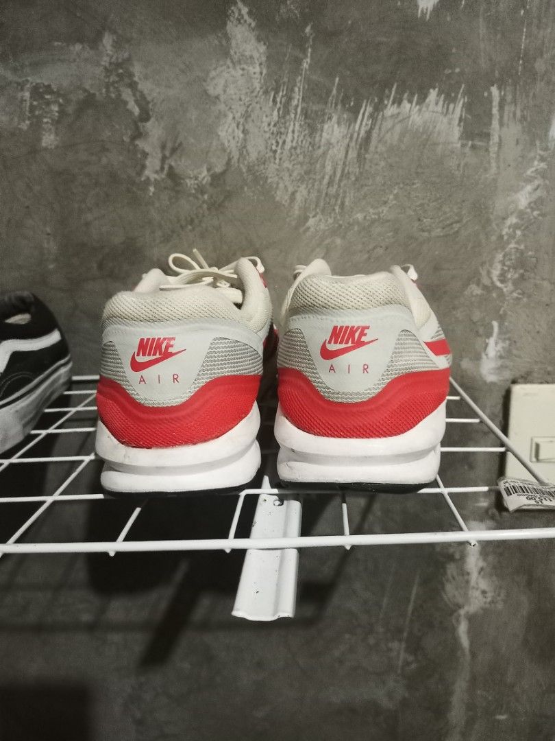 Nike Air Max Lunar1 White Red US 8 (Category: Sneakers) located in Mabalacat. Submitted by hasashoe (Listing ID 1469176279, Image 2). Description: - Model: Nike Air Max Lunar1 (Style Code: 654469-101) - Colorway: White and Red - Size: US 8, UK 7, EUR 41 (26 cm) - Design: White mesh upper with red mudguard, Swoosh branding, and visible Air unit - Condition: Soles show moderate wear from previous use - Style: Classic retro runner.