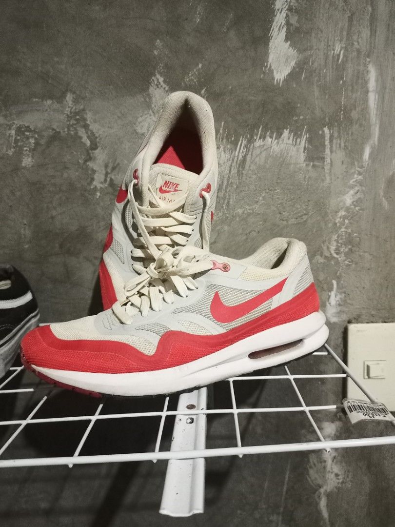 Nike Air Max Lunar1 White Red US 8 (Category: Sneakers) located in Mabalacat. Submitted by hasashoe (Listing ID 1469176279, Image 1). Description: - Model: Nike Air Max Lunar1 (Style Code: 654469-101) - Colorway: White and Red - Size: US 8, UK 7, EUR 41 (26 cm) - Design: White mesh upper with red mudguard, Swoosh branding, and visible Air unit - Condition: Soles show moderate wear from previous use - Style: Classic retro runner.