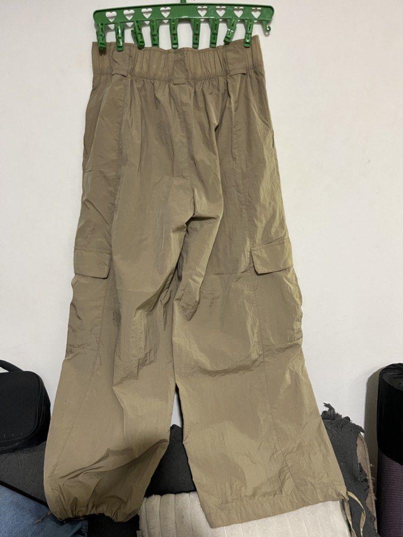 Nike Beige Nylon Cargo Pants Size L (Category: Joggers) located in Manila. Submitted by mazerunnr (Listing ID 1469307052, Image 2). Description: - Brand: Nike - Item: Cargo Pants - Color: Beige - Size: L - Material: 100% Nylon (Body & Lining) - Fit: Relaxed utility fit - Features: Elastic waistband with printed Nike logo, snap button closure, side cargo pockets - Condition: Almost Brand new / Excellent quality.