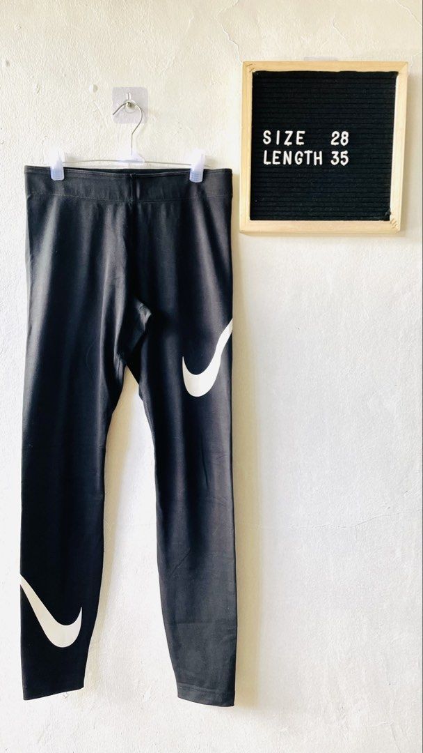 Nike Black Leggings (Category: Activewear) located in Caloocan City. Submitted by lovemyclothes21 (Listing ID 1469269742, Image 1). Description: - Brand: Nike - Color: Classic Black with White Swoosh on hip and lower leg - Size: 28 waist / 35 length - Material: Cotton and stretch blend (Made in Sri Lanka) - Condition: Great / Comfort-focused - Best for: Workouts, gym sessions, or daily casual wear - Features: Super comfortable, breathable, and ea