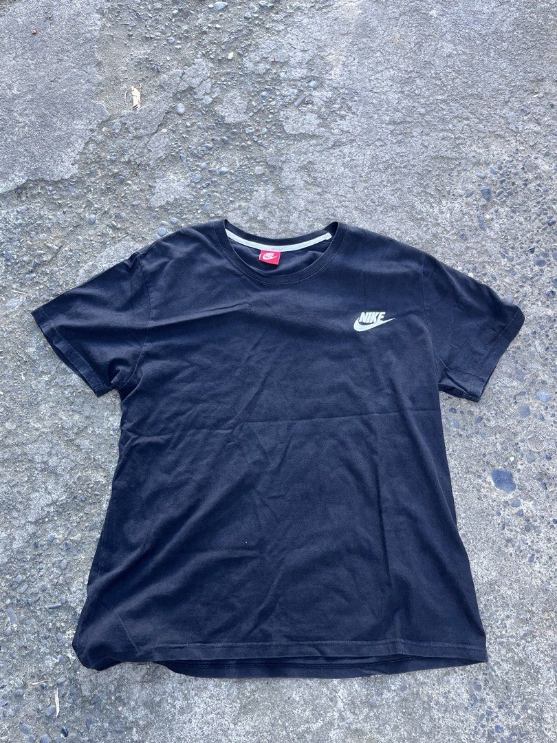 Nike Black T-Shirt with Small Logo (Category: Tshirts & Polo Shirts ) located in Manila. Submitted by coybns (Listing ID 1469188217, Image 1). Description: - Brand: Nike - Color: Solid Black with white chest logo - Fit: Standard fit, short sleeves - Material: Soft, breathable cotton - Details: Classic crew neck with white inner taping - Condition: Brand new / Excellent - Mode of Payment: GCash, BPI, or COD via app - Shipping: Fast shipping via J&