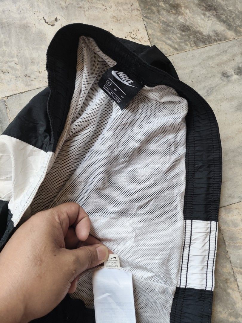 Nike Black White Panel Swim Trunks Shorts Size XL (Category: Swim Trunks & Board Shorts) located in Manila. Submitted by glenndejes07057 (Listing ID 1469302275, Image 2). Description: - Brand: Nike - Color: Black with bold white vertical front panel and Swoosh logo - Size: XL - Features: Elastic waistband with adjustable drawstring, comfortable inner mesh lining - Ideal for: Swimming, casual wear, or workouts.