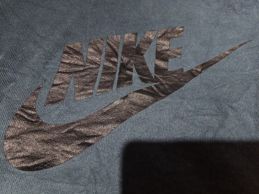 Nike Blue Sweatshorts Mens Medium (Category: Shorts) located in Maasim. Submitted by ukayganda25 (Listing ID 1469269336, Image 2). Description: - Color: Dark blue with oversized black Nike logo on the leg - Size: Medium (fits waistline 28 to 34) - Length: 19 inches with a trendy raw edge hem - Material: 100% cotton, Made in Malaysia - Features: Elastic waistband with adjustable drawstring and two convenient side pockets - Style: Comfortable every