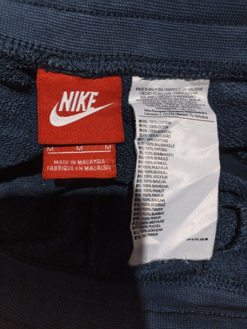 Nike Blue Sweatshorts Mens Medium (Category: Shorts) located in Maasim. Submitted by ukayganda25 (Listing ID 1469269336, Image 3). Description: - Color: Dark blue with oversized black Nike logo on the leg - Size: Medium (fits waistline 28 to 34) - Length: 19 inches with a trendy raw edge hem - Material: 100% cotton, Made in Malaysia - Features: Elastic waistband with adjustable drawstring and two convenient side pockets - Style: Comfortable every