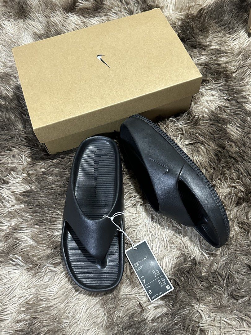 Nike Calm Flip Flop Black FD4119 001 (Category: Slippers & Slides) located in Manila. Submitted by bizfits_ (Listing ID 1469357702, Image 1). Description: - Item: Brand New Black Nike Calm Slides / Flip Flops - Condition: Brand new with tags attached, original shoebox included - Size: Men's US 7 / Women's US 8 - Features: Super comfortable foam construction, textured footbed, and sleek minimalist strap - Fulfillment: Ready to ship or available fo