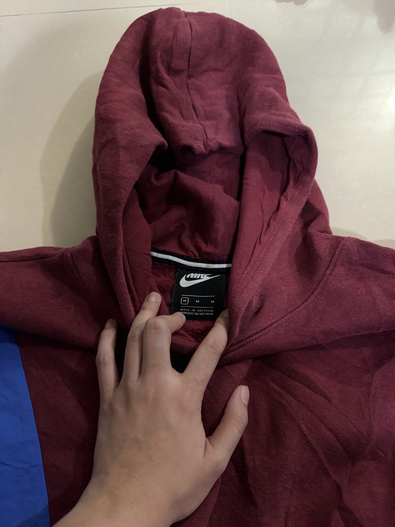 Nike Colorblock Hoodie Jacket (Category: Coats, Jackets and Outerwear) located in Manila. Submitted by zna_onlineshop (Listing ID 1469235275, Image 2). Description: - Brand: Nike - Style: Colorblock hoodie (maroon, blue, teal, black) - Size: Medium - Features: Embroidered chest logo, warm fleece lining, smooth nylon sleeves/lower panels, white drawstring hem - Origin: Made in Vietnam - Perfect for daily casual wear.