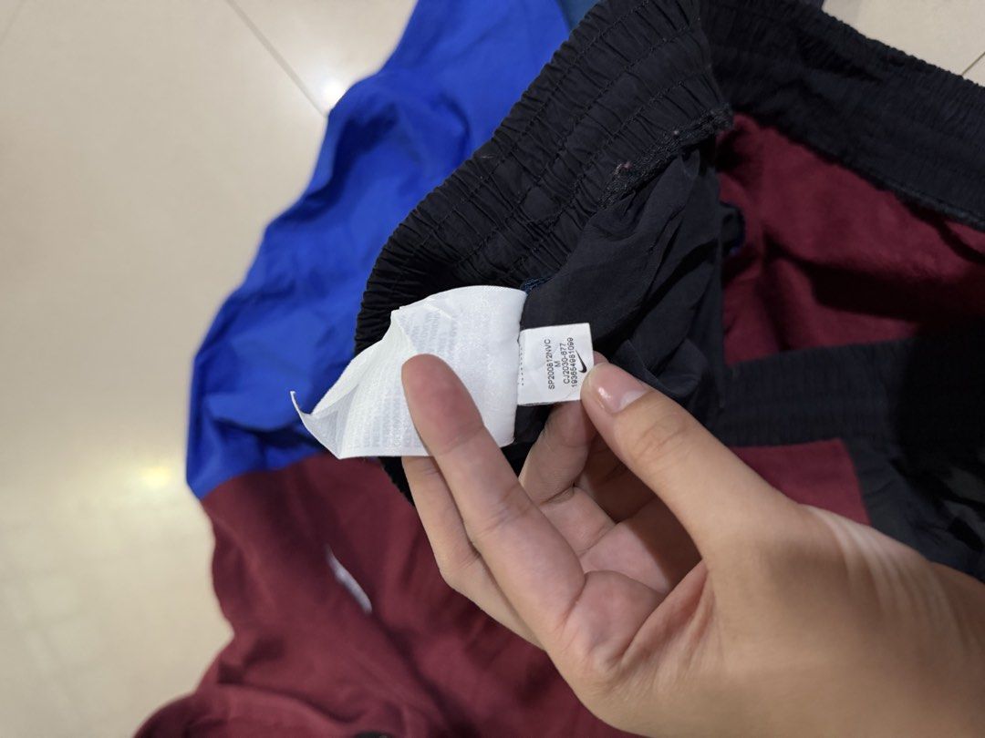 Nike Colorblock Hoodie Jacket (Category: Coats, Jackets and Outerwear) located in Manila. Submitted by zna_onlineshop (Listing ID 1469235275, Image 3). Description: - Brand: Nike - Style: Colorblock hoodie (maroon, blue, teal, black) - Size: Medium - Features: Embroidered chest logo, warm fleece lining, smooth nylon sleeves/lower panels, white drawstring hem - Origin: Made in Vietnam - Perfect for daily casual wear.