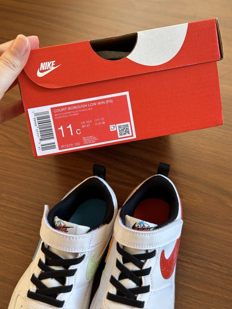 Nike Court Borough Low (Category: Babies & Kids Fashion) located in Manila. Submitted by nolanandpio (Listing ID 1469206687, Image 2). Description: - Brand: Nike - Model: Court Borough Low Win (Kids) - Size: UK 10.5 / EUR 28 / 17 cm - Colorway: White base with multi-colored swoosh (blue, green, orange, red) - Closure: Black laces with top Velcro strap - Condition: Brand new, never worn - Packaging: Comes with original red Nike box Used once. Pina