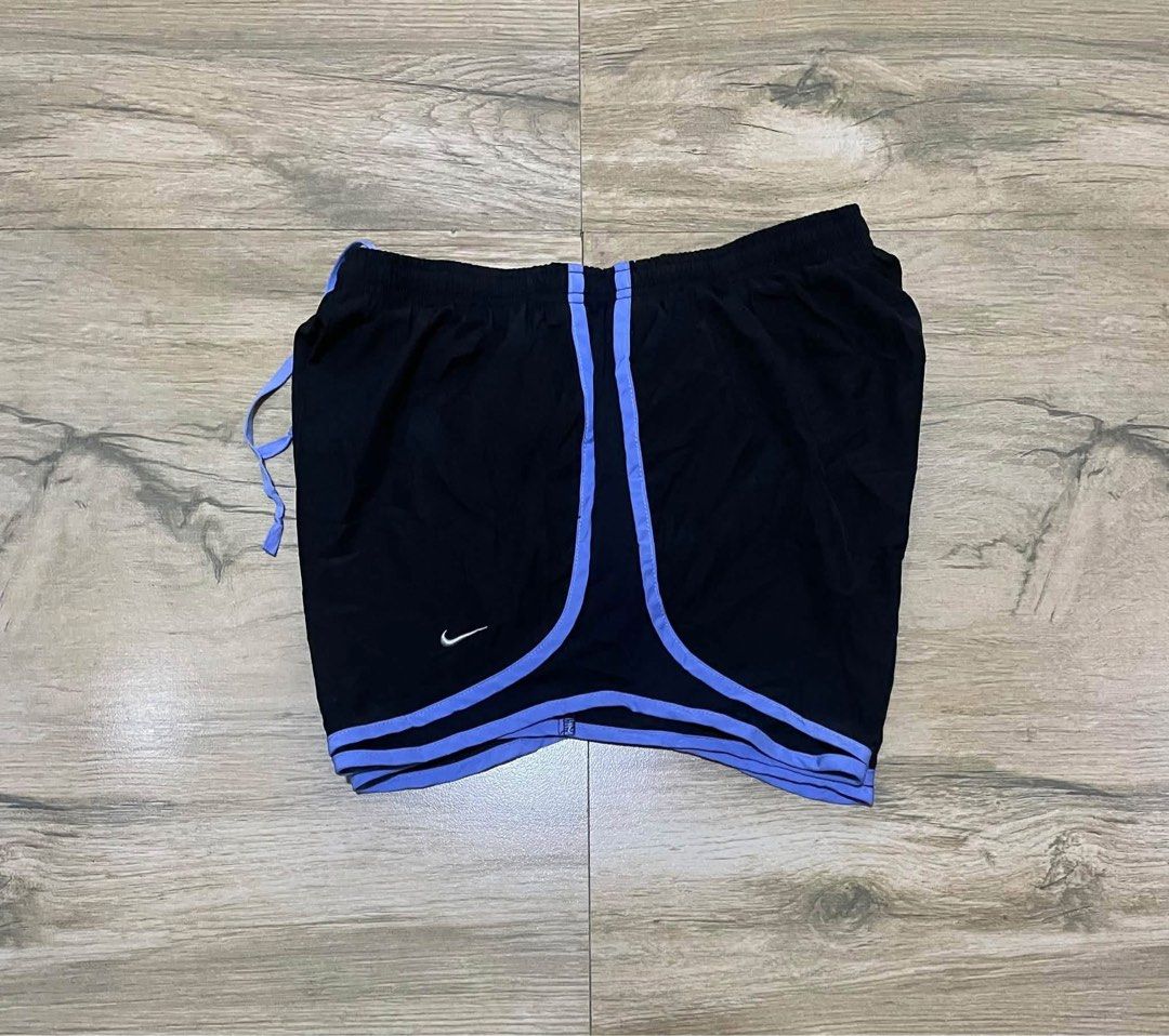 Nike Dri-FIT Tempo athletic Running Short (Category: Shorts) located in San Carlos City. Submitted by roseee_012 (Listing ID 1469292677, Image 3). Description: - Brand: Nike - Type: Running shorts - Color: Black with light purple trim - Size: Medium - Material/Feature: Dri-FIT inner liner to keep you dry - Waistband: Elastic with adjustable drawstring - Condition: Clean, no marks or damage.
