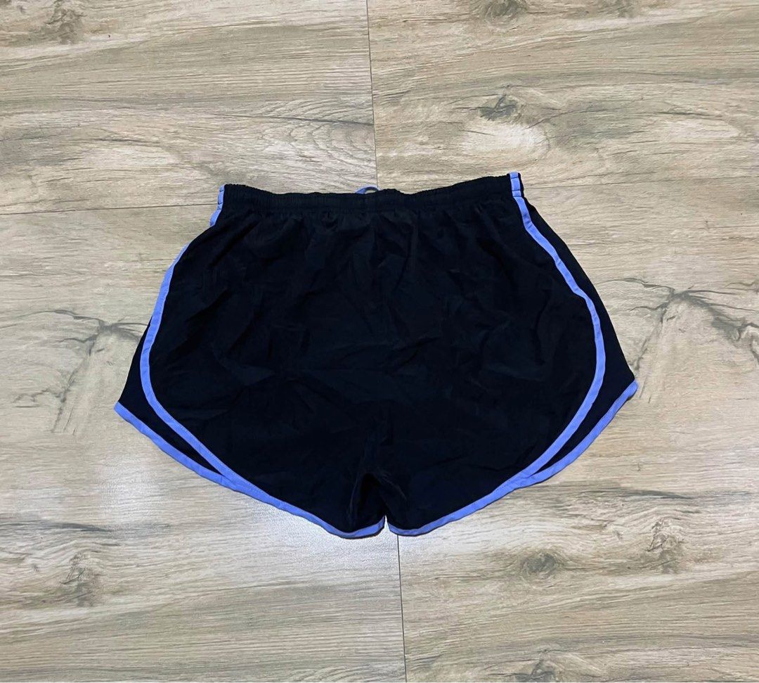 Nike Dri-FIT Tempo athletic Running Short (Category: Shorts) located in San Carlos City. Submitted by roseee_012 (Listing ID 1469292677, Image 2). Description: - Brand: Nike - Type: Running shorts - Color: Black with light purple trim - Size: Medium - Material/Feature: Dri-FIT inner liner to keep you dry - Waistband: Elastic with adjustable drawstring - Condition: Clean, no marks or damage.
