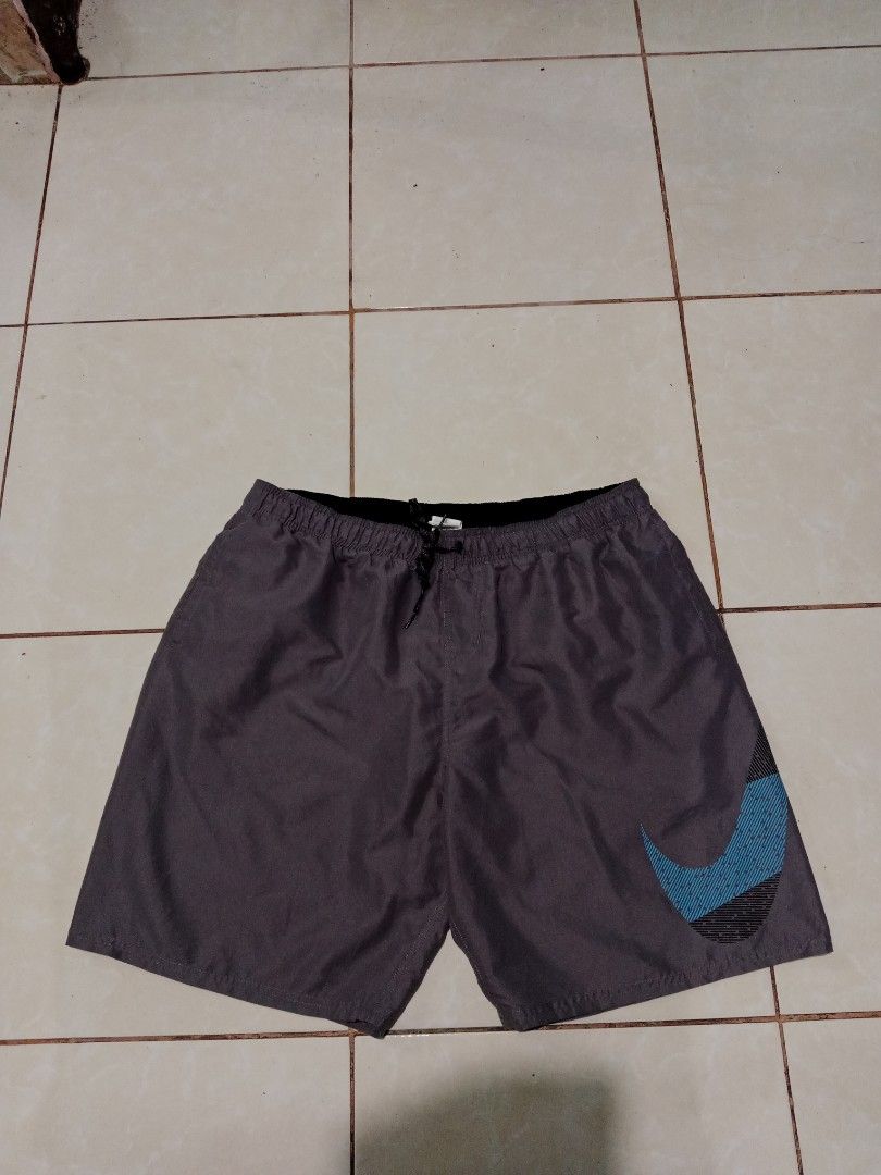 Nike Gray Shorts XXL (Category: Shorts) located in Bacolod City. Submitted by jorengrate26639 (Listing ID 1469327629, Image 2). Description: - Brand: Nike - Size: XXL Best Fit Large 34-36 - Color: Gray with blue and black textured Big Swoosh logo - Waistband: Elastic with interior drawstring for an adjustable fit - Fabric: Lightweight and breathable - Condition/Origin: Made in China, great for workouts or casual lounging.
