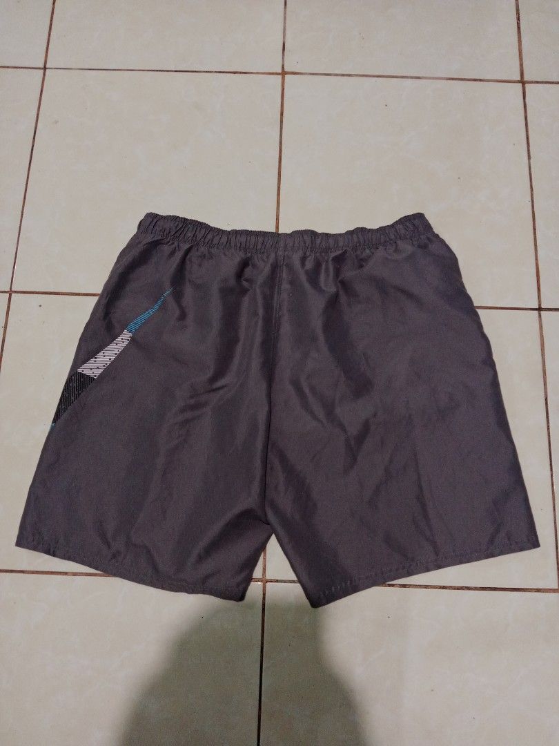 Nike Gray Shorts XXL (Category: Shorts) located in Bacolod City. Submitted by jorengrate26639 (Listing ID 1469327629, Image 3). Description: - Brand: Nike - Size: XXL Best Fit Large 34-36 - Color: Gray with blue and black textured Big Swoosh logo - Waistband: Elastic with interior drawstring for an adjustable fit - Fabric: Lightweight and breathable - Condition/Origin: Made in China, great for workouts or casual lounging.