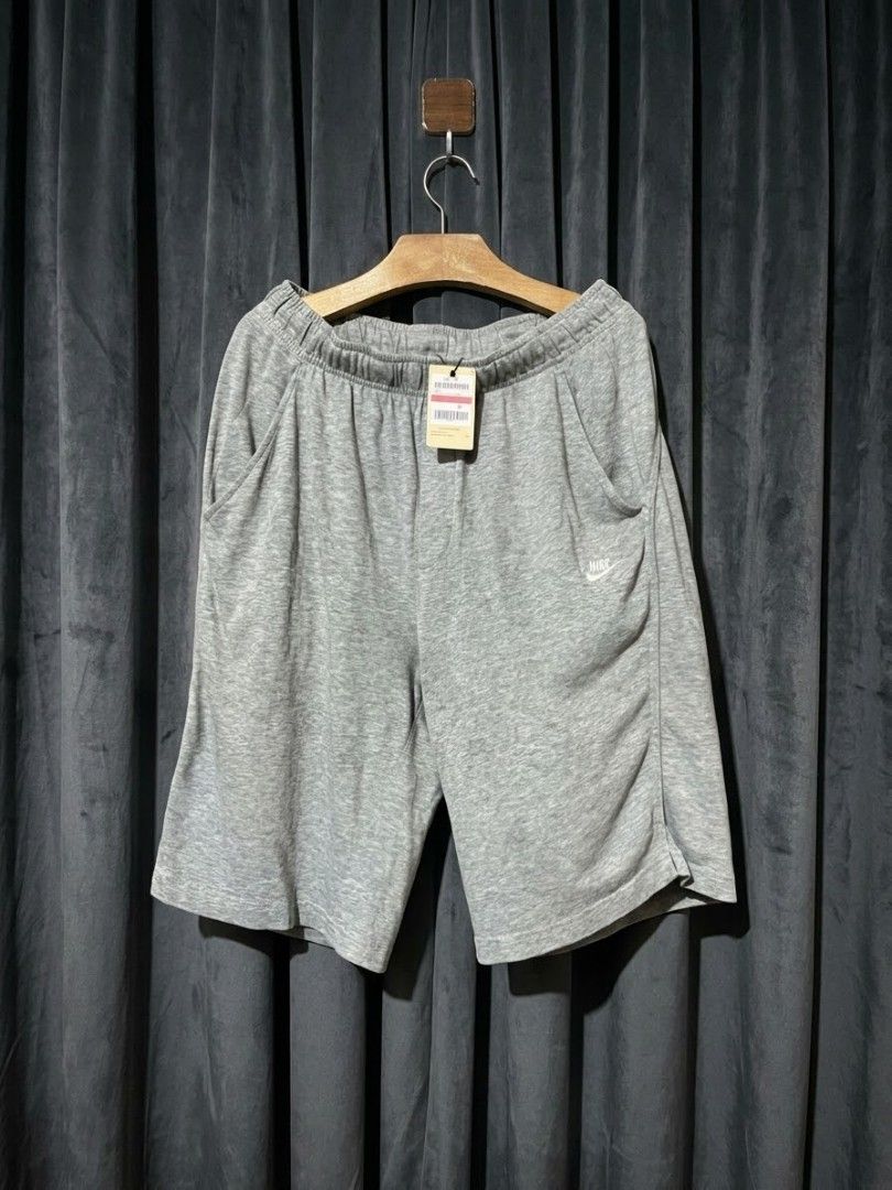 Nike Grey Sweatshorts with Tag (Category: Shorts) located in Manila. Submitted by realjude (Listing ID 1469345469, Image 1). Description: - Brand: Nike - Color: Grey - Material: Soft cotton fleece - Condition: Brand new with original store tag - Fit: Regular fit, casual style - Features: Elastic waistband with inner drawstring, two side pockets, and embroidered white Nike logo on the left leg - Best for: Lounging, running errands, or working out.