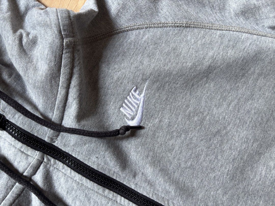 Nike Grey Zip Hoodie Size XL (Category: Hoodies) located in Caloocan City. Submitted by keepinhighl (Listing ID 1469232264, Image 2). Description: XL on tag 28x23 - Brand: Nike - Color: Grey with red interior neck tag - Size: XL (Regular Fit) - Material: Comfortable cotton blend, great for daily wear - Details: Nike-branded zipper pull, ribbed black hood drawstrings - Origin: Made in China.