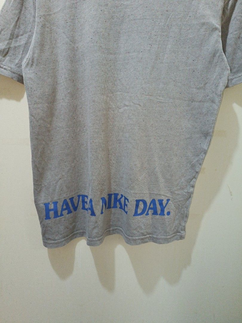 Nike Have A Nike Day Shirt (Category: Tshirts & Polo Shirts ) located in Makati City. Submitted by ivsseyow03 (Listing ID 1469278959, Image 3). Description: Grey speckled cotton t-shirt from Nike. Loose fit style with short sleeves. Chest embroidery includes blue text and a white daisy flower. Back hem features large blue Have A Nike Day text. Inside tag shows style code DM6334-289..