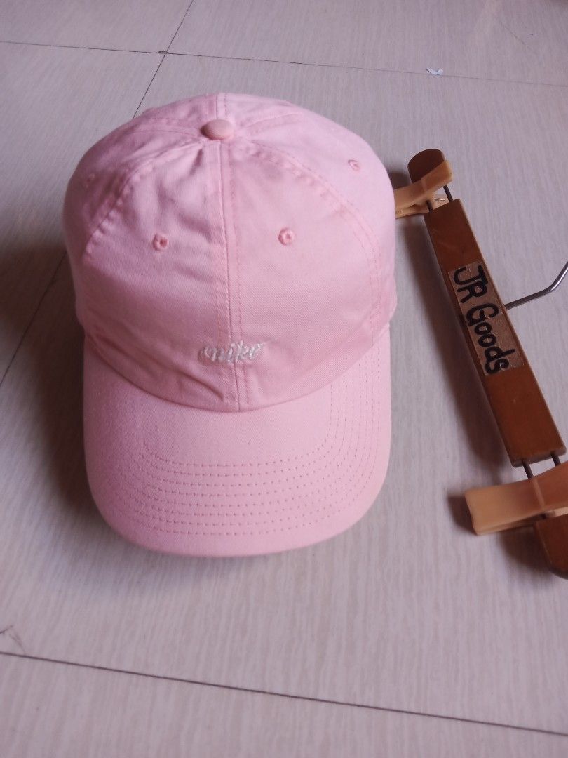 Nike Heritage86 Pink Cap (Category: Activewear) located in Tanay. Submitted by jrgoods (Listing ID 1469337567, Image 2). Description: - Authentic Nike Heritage86 cap in a cute pastel pink shade Nlke heritage cap(unisex) Osfa Excellent to new condition 380+ship Tanay Rizal location Shipping Nationwide - Features a chic white cursive Nike logo embroidered on the front - Classic six-panel design with embroidered eyelets for breathability - Adjustabl