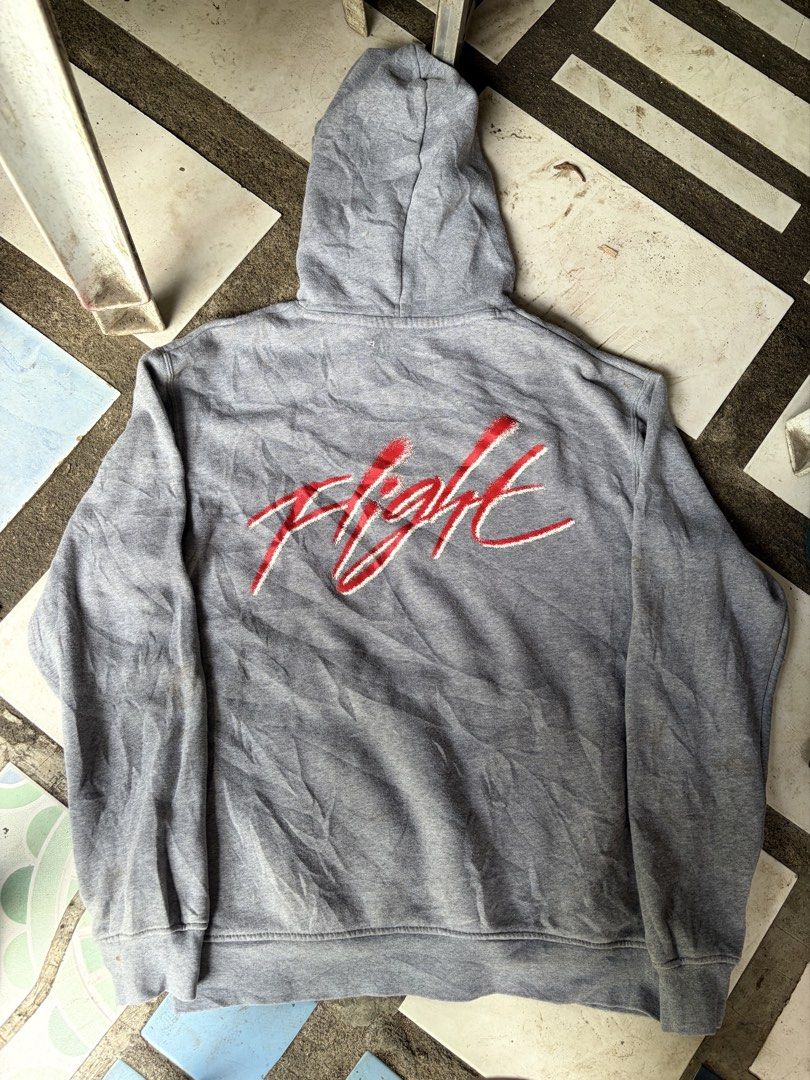 Nike Jordan Flight Grey Hoodie (Category: Hoodies) located in Manila. Submitted by nickol17 (Listing ID 1469324015, Image 2). Description: - Authentic grey Jordan hoodie for everyday streetwear - Features embroidered classic Jumpman logo and Flight script on the chest - Bold Flight graphic embroidered across the back - Practical front kangaroo pocket and attached hood - Snug fit with ribbed cuffs and hem.