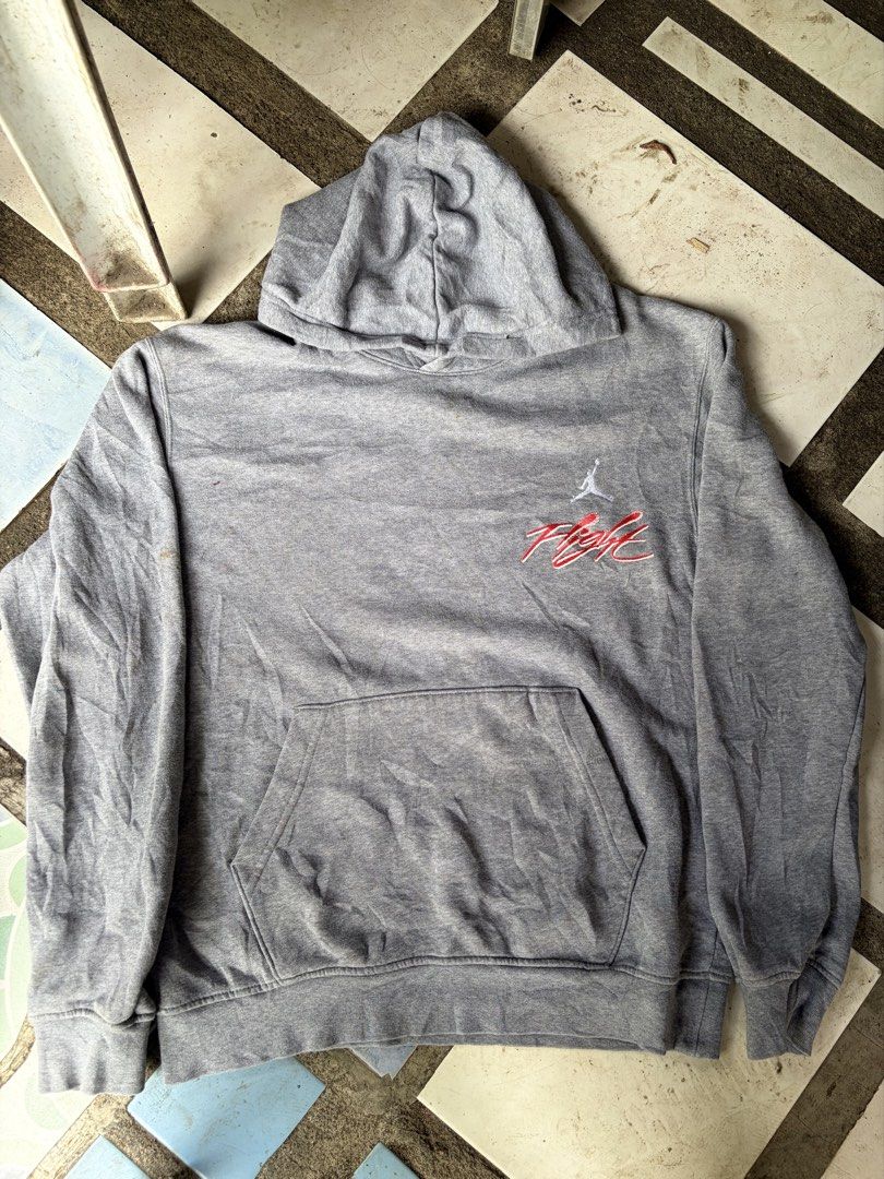 Nike Jordan Flight Grey Hoodie (Category: Hoodies) located in Manila. Submitted by nickol17 (Listing ID 1469324015, Image 1). Description: - Authentic grey Jordan hoodie for everyday streetwear - Features embroidered classic Jumpman logo and Flight script on the chest - Bold Flight graphic embroidered across the back - Practical front kangaroo pocket and attached hood - Snug fit with ribbed cuffs and hem.