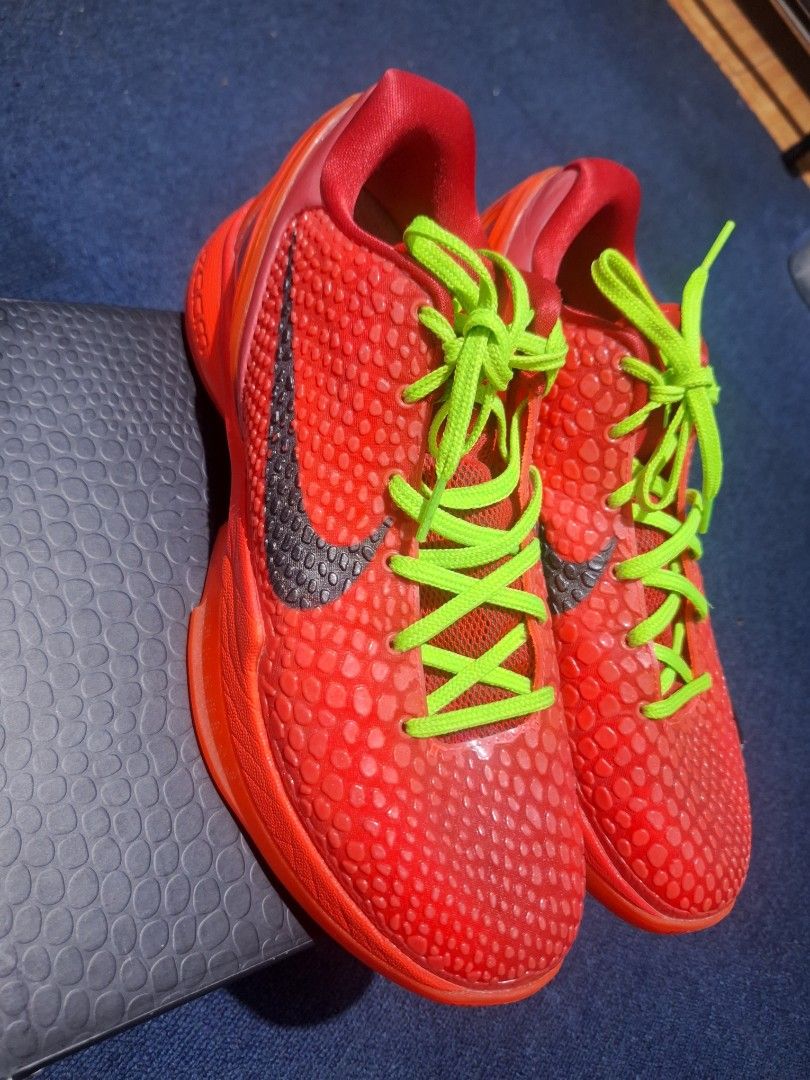 Nike Kobe 6 Protro Reverse Grinch GK batch (Category: Sneakers) located in Manila. Submitted by adolphreyes645 (Listing ID 1469286670, Image 1). Description: - Model: Bright red basketball sneakers with snakeskin texture - Accents: Bold lime green laces and dark grey Nike swoosh - Condition: Clean soles, crisp laces, excellent overall condition - Packaging: Comes with original matching snake-textured shoe box - Versatility: Perfect for both baske