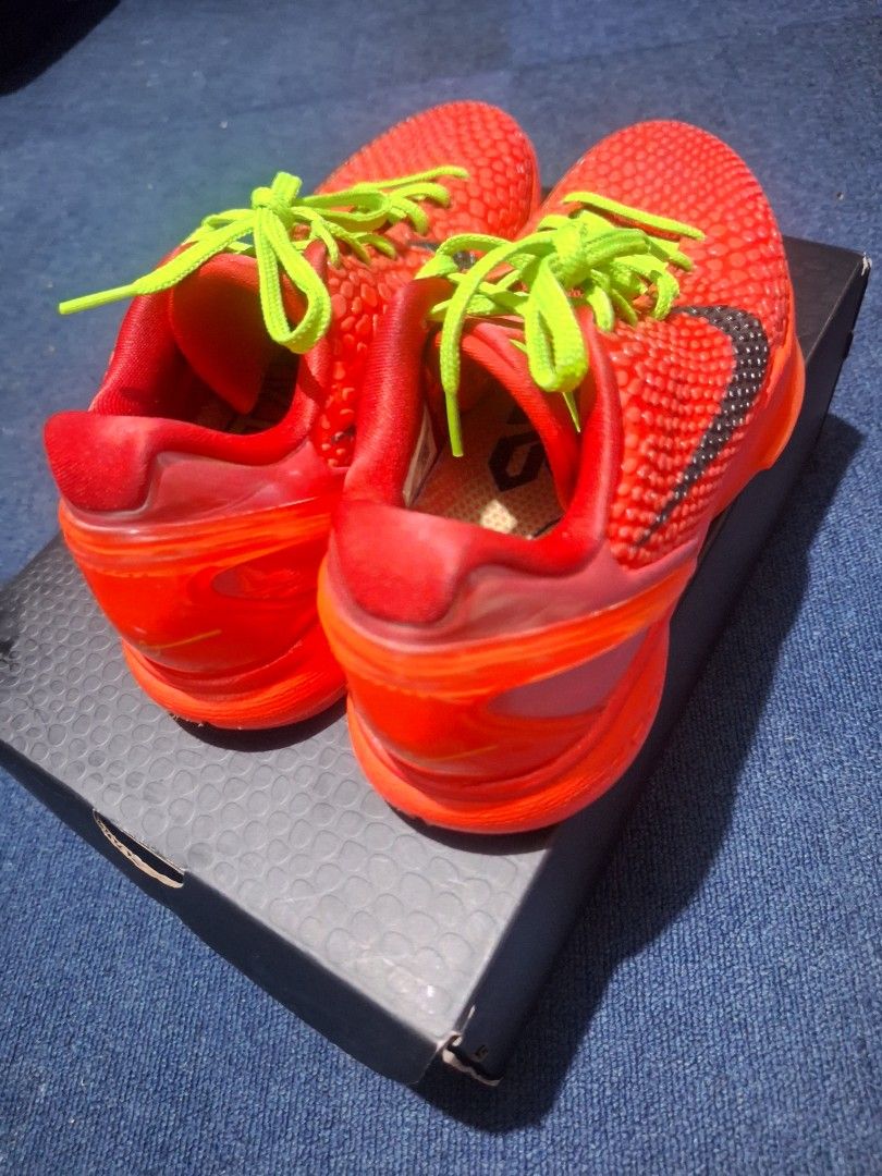 Nike Kobe 6 Protro Reverse Grinch GK batch (Category: Sneakers) located in Manila. Submitted by adolphreyes645 (Listing ID 1469286670, Image 3). Description: - Model: Bright red basketball sneakers with snakeskin texture - Accents: Bold lime green laces and dark grey Nike swoosh - Condition: Clean soles, crisp laces, excellent overall condition - Packaging: Comes with original matching snake-textured shoe box - Versatility: Perfect for both baske