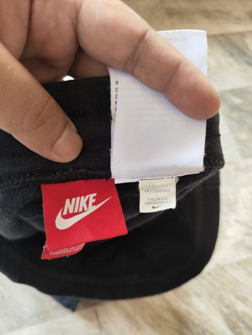 Nike Men's Black Shorts with White Logo (Category: Shorts) located in Manila. Submitted by glenndejes07057 (Listing ID 1469301143, Image 3). Description: - Authentic Nike shorts in classic black (Style code: 836278-010) - Size: Large - Bold white swoosh and logo printed on the left leg - Comfortable drawstring waistband with white cords - Convenient side pockets for daily essentials - Trendy raw edge hem at the bottom - Complete with material tag