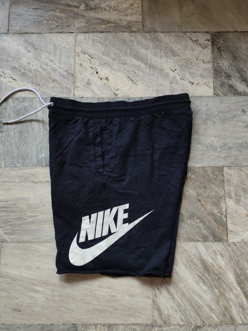 Nike Men's Black Shorts with White Logo (Category: Shorts) located in Manila. Submitted by glenndejes07057 (Listing ID 1469301143, Image 1). Description: - Authentic Nike shorts in classic black (Style code: 836278-010) - Size: Large - Bold white swoosh and logo printed on the left leg - Comfortable drawstring waistband with white cords - Convenient side pockets for daily essentials - Trendy raw edge hem at the bottom - Complete with material tag