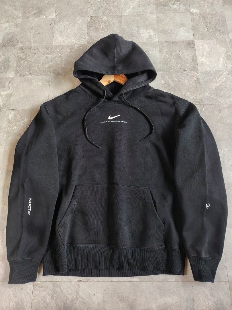 Nike NOCTA Black Hoodie (Category: Coats, Jackets and Outerwear) located in Dasmarinas. Submitted by clydegallo40531 (Listing ID 1469187193, Image 1). Description: - Authentic Black Nike NOCTA Hoodie - Color: Black with white branding - White Nike swoosh logo below neckline with small text - NOCTA branding printed down the right sleeve - Small trident graphic on the lower left sleeve - Functional front kangaroo pocket - Adjustable drawstrings on 