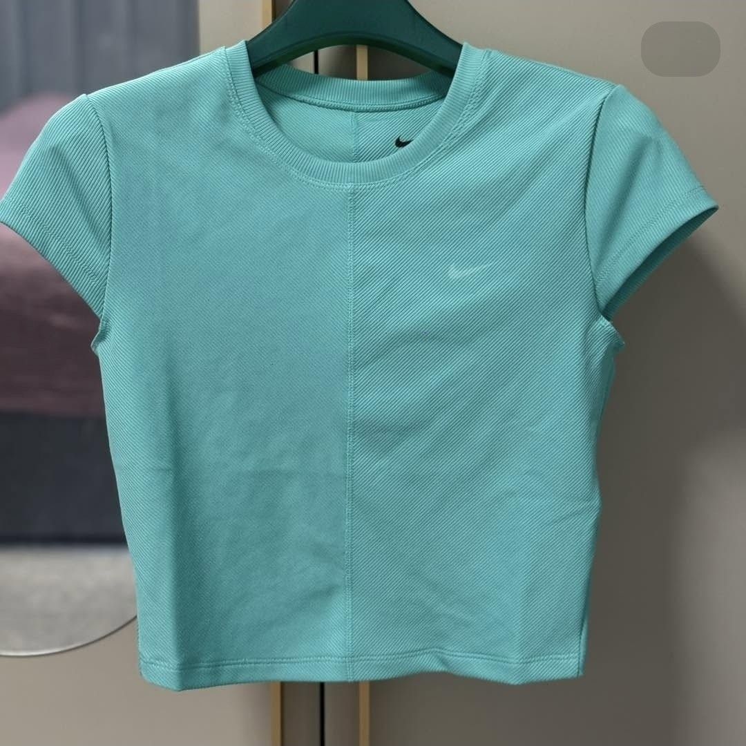 Nike one fitted ribbed shirt (Category: Activewear) located in Las Pinas. Submitted by badudettes (Listing ID 1469303889, Image 3). Description: Original price 1,995 Bought in Nike App Twice worn only XL on tag, but best fits L Cropped top rfs: bigger tummy.