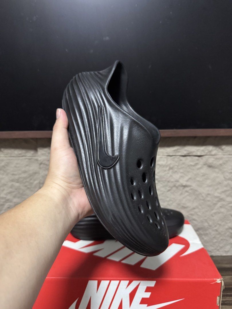 Nike rejuven8 Triple Black Slides (Category: Slippers & Slides) located in Caloocan City. Submitted by onetwelvetwelve (Listing ID 1469317363, Image 2). Description: - Model: Nike Calile Mule - Colorway: Triple Black - Material: Super lightweight foam - Design: Slip-on style with curved ribbed textures on the sides and ventilation holes on the toe box for breathability - Branding: Nike Swoosh stamped on the lateral side - Perfect for daily casual