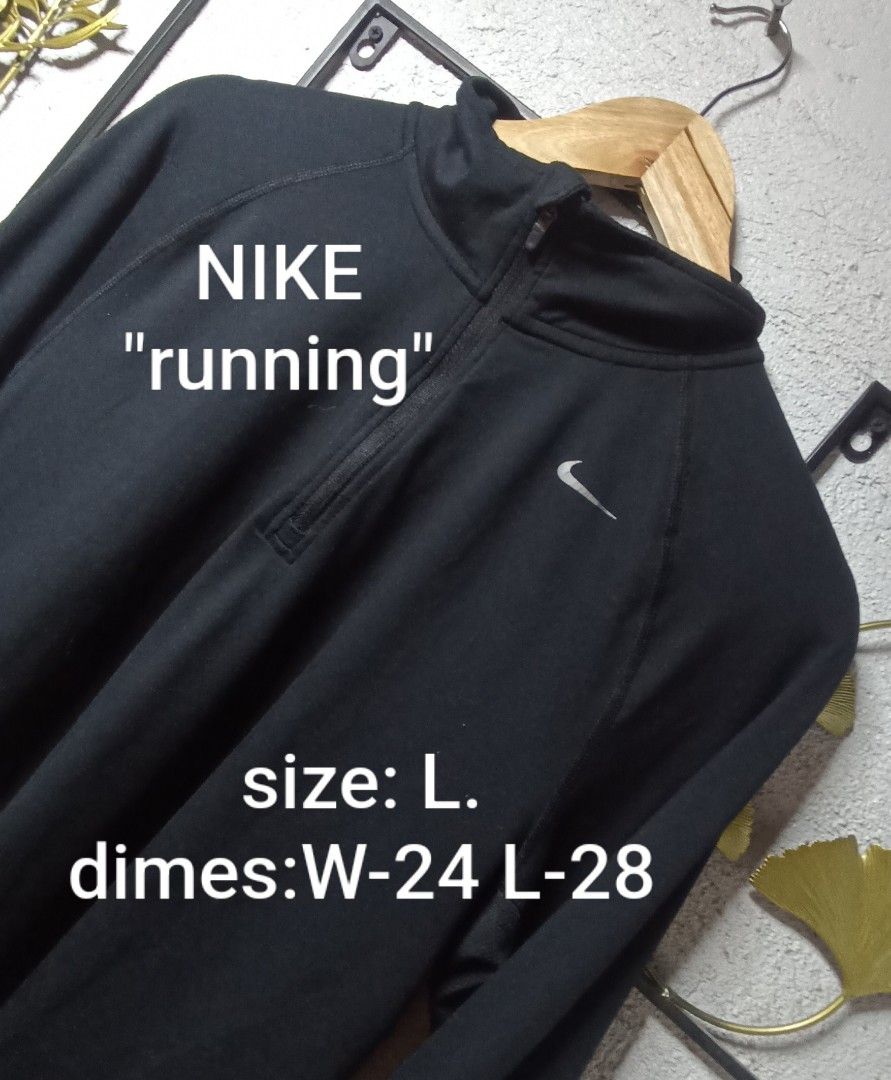 Nike Running Dri-Fit Black 1/4 Zip Pullover (Category: Coats, Jackets and Outerwear) located in Kawit. Submitted by deidzdzn (Listing ID 1469288906, Image 1). Description: - Brand: Nike - Style: Running quarter-zip pullover - Color: Black with silver swoosh logo on chest - Material: Dri-FIT moisture-wicking fabric - Size: Large (Width: 24", Length: 28") - Features: High collar with zip closure, long sleeves - Condition/Use: Great athletic layer f